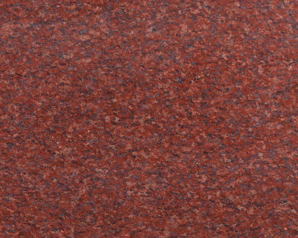 Imperial Red Granite, premium Indian red granite with black and white flecks, ideal for exterior cladding, monuments, and flooring.